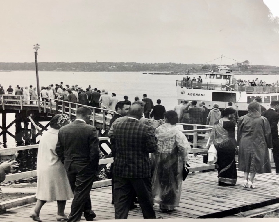 people walking on a boarding pier